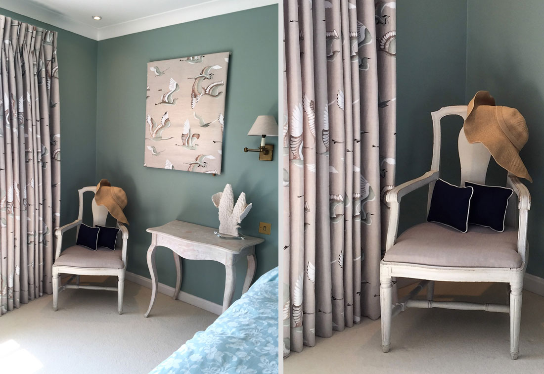 Master bedroom of a house in Bosham West Sussex designed by interior designer Suzi Searle with muted green walls and soft pink furnishings