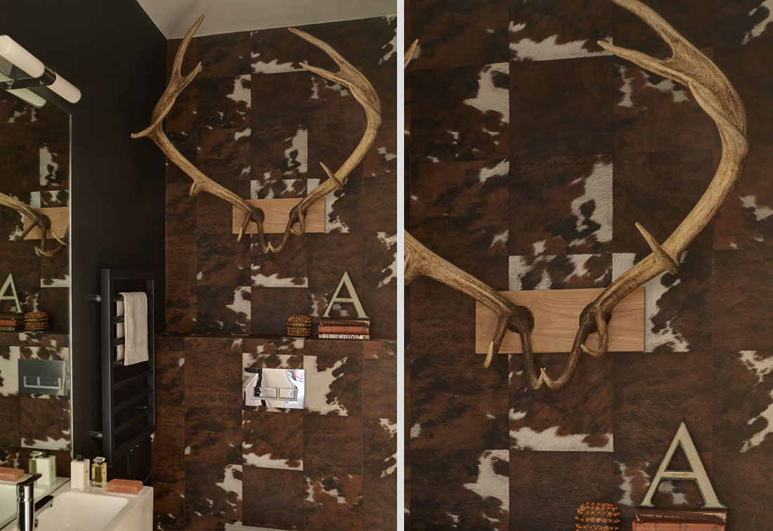 West London apartment with unusual cow hide tiles and antlers on the wall of the toilet, by Suzi Searle Interiors