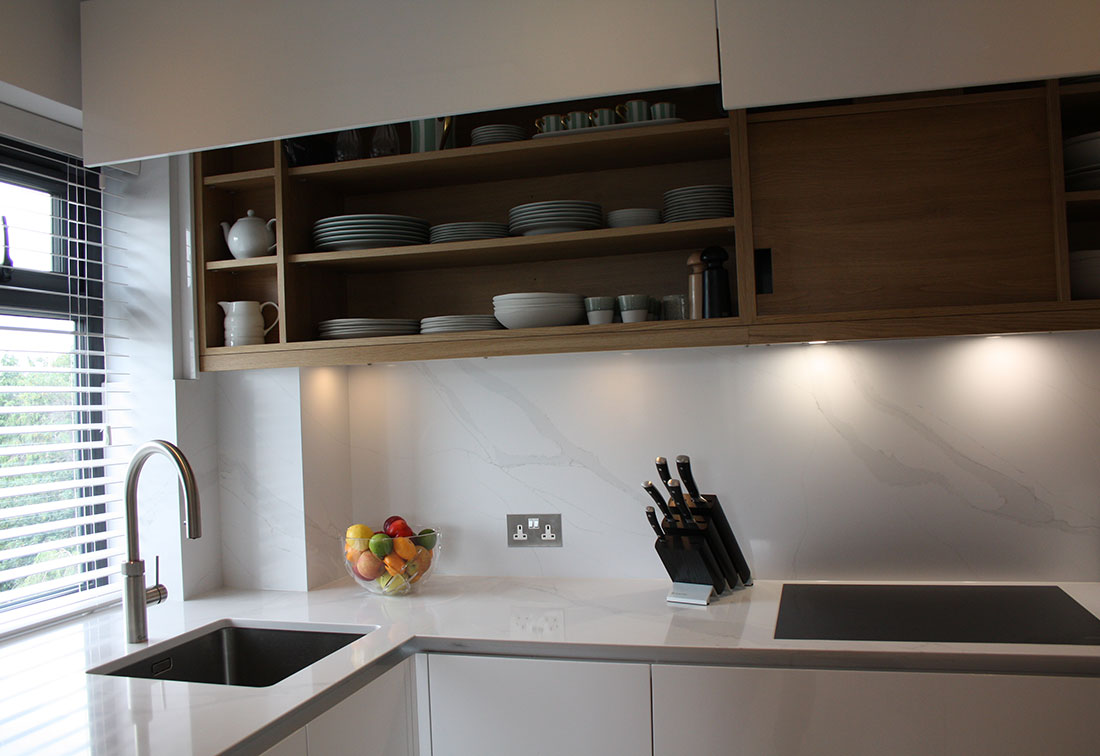Designer kitchen by West London interior designer Suzi Searle with white worktops and wooden cupboards