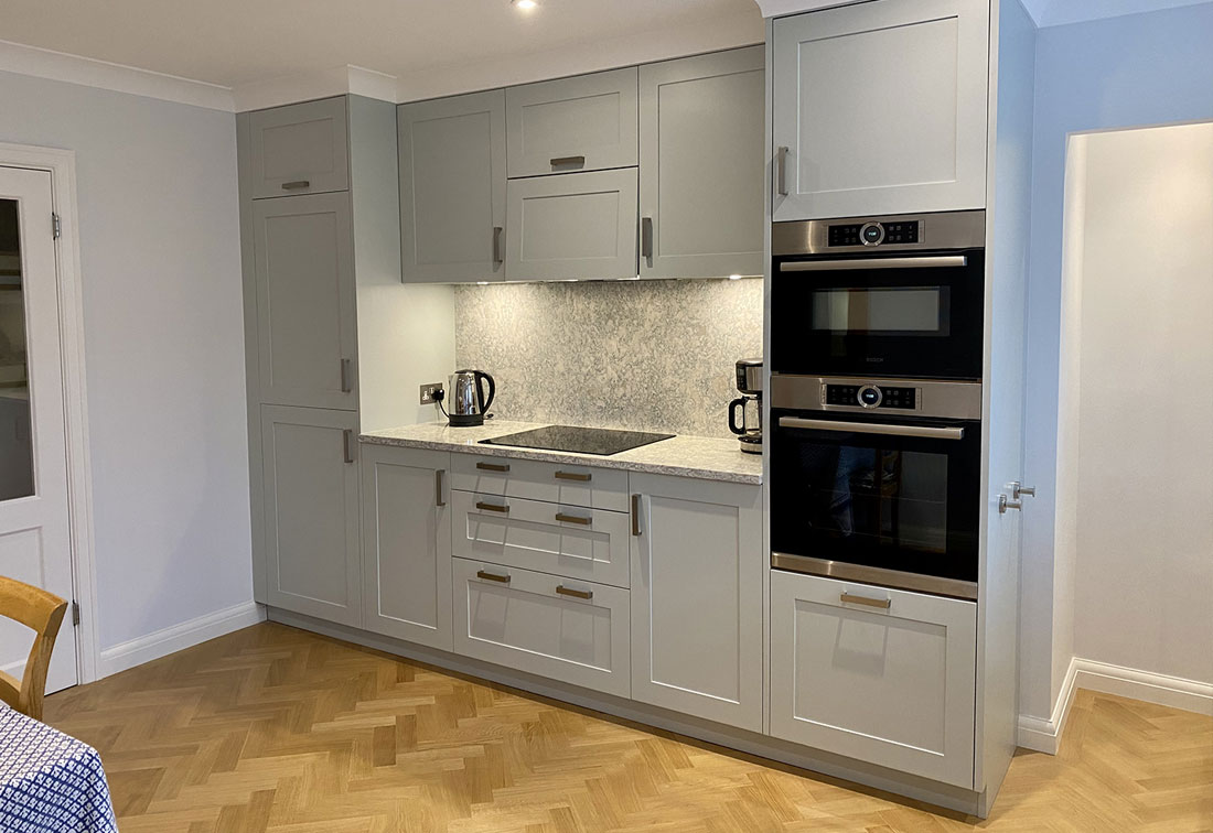 Chiswick mansion block kitchen re-design with parquet flooring and marble worktops